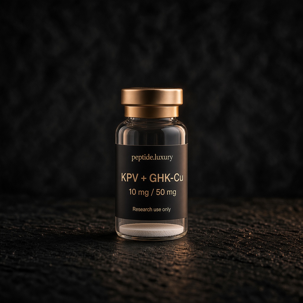 peptide.luxury branded KPV + GHK-Cu blend research vial with black and champagne-gold label on dark stone.